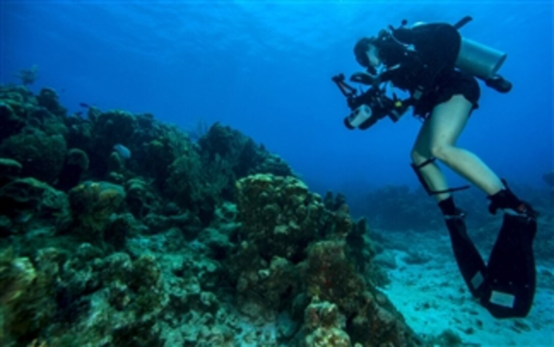 U. S. Navy Petty Officer 2nd Class Kathleen Gorby conducts underwater photography training off the coast of Guantanamo Bay, Cuba, on April 19, 2013.  The Underwater Photo Team of Expeditionary Combat Camera conducts semi-annual training.  