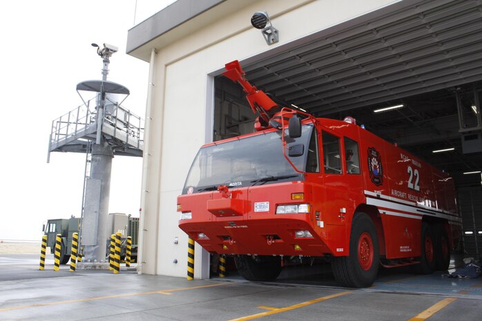 Station Aircraft Rescue Fire Fighting’s Morita Airport Crash Tender MAF-125 exits the ARFF warehouse after undergoing a maintenance check at Marine Corps Air Station Iwakuni, Japan, April 11, 2013.