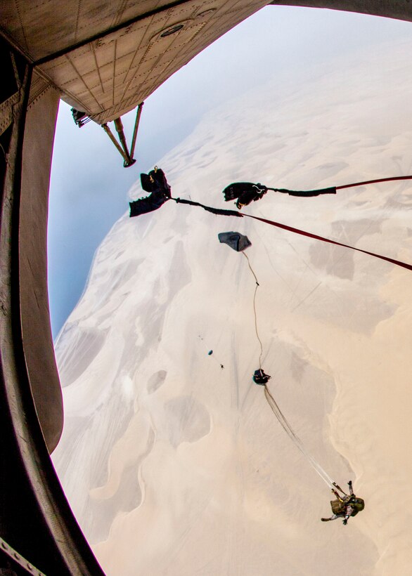 26th Marine Expeditionary Unit (MEU) Maritime Raid Force Marines exit a CH-53E Super Stallion assigned to Marine Medium Tiltrotor Squadron (VMM) 266 Reinforced, while conducting a parachute operation over Qatar, April 25, 2013. Eagle Resolve is an annual multilateral exercise designed to enhance regional cooperative defense efforts in the Gulf Cooperation Council nations and U.S. Central Command. The 26th MEU is deployed to the 5th Fleet area of operations aboard the Kearsarge Amphibious Ready Group. The 26th MEU operates continuously across the globe, providing the president and unified combatant commanders with a forward-deployed, sea-based quick reaction force. The MEU is a Marine Air-Ground Task Force capable of conducting amphibious operations, crisis response and limited contingency operations.  (U.S. Marine Corps photo by Cpl. Christopher Q. Stone, 26th MEU Combat Camera/Released)
