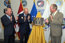 Commander's Community Leader Commendation recipients William J. Hybl (left) and William B. Tutt (right) join Gen. Gene Renuart in unveiling a plaque commemorating their commendations April 21 at the NORAD and USNORTHCOM headquarters on Peterson Air Force Base. The Commander’s Community Leader Commendation is intended to recognize outstanding support by local community leaders who have been strong public advocates for the commands, the Department of Defense and the United States.Photo by Tech. Sgt. Aaron Bujan
