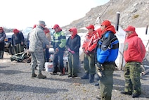 General Gene Renuart, is greeted by a patrol of Canadian Rangers in the Mackenzie River Delta near Inuvik, Northwest Territories May 11. Canadian Rangers are part-time reservists providing a military presence in remote, isolated and coastal communities. Formally established in 1947, Canadian Rangers are responsible for protecting Canada's sovereignty by reporting unusual activities or sightings, collecting local data of significance to the Canadian Forces, and conducting surveillance or sovereignty patrols as required. There are currently 4,200 Canadian Rangers in 165 communities across Canada.

Photo by Wendy Gilmour
