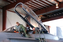 General Gene Renuart, NORAD and U.S. Northern Command commander, prepares to exit a CF-18 after flying with Canadian LCol. Sean Penney, 409th Tactical Fighter Squadron commanding officer, from Forward Operating Location Yellowknife to FOL Inuvik during his visit May 11.