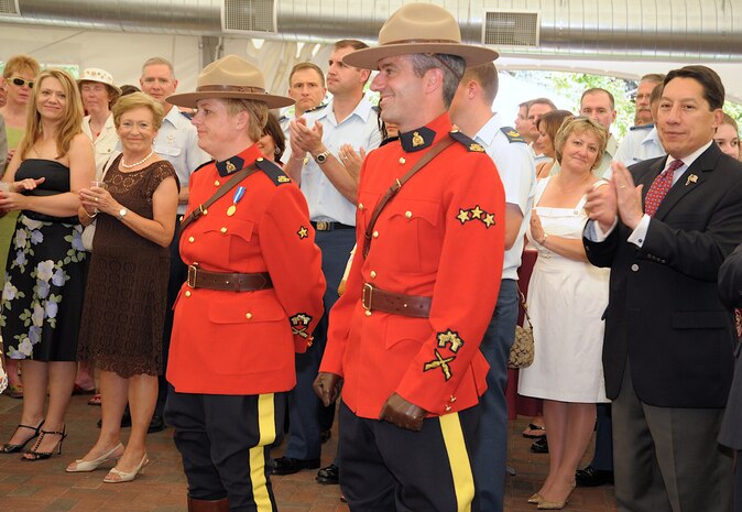 Members of the Royal Canadian Mounted Police are recognized by the ...