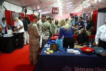 Marines speak with different vendors and organizations at the Marine South Military Exposition at the Goettge Memorial Field House aboard Marine Corps Base Camp Lejeune, April 10-11. The Expo allows Marines to view and give feedback of the latest advancements in military equipment and technology.
