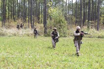 Marines with Marine Wing Support Squadron 272 patrol the area around their secured landing field during a field training exercise aboard Marine Corps Base Camp Lejeune, April 17. Marines With Marine Wing Support Squadron 272 took to the field to hone the skills learned during Marine Combat Training and to practice airbase ground defense, one of the squadron’s mission essential tasks. 

