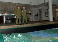 Colonel Bill Veenhof (right), Air Component Commander of Joint Task Force Games, briefs North American Aerospace Defense Command (NORAD) Deputy Commander Lieutenant-General Marcel Duval (left) about air operations for the Olympics using a floor-based map at the Integrated Security Unit Headquarters in Richmond, B.C.

Operation PODIUM is the Canadian Forces (CF) contribution to the overall security of the Vancouver 2010 Olympic and Paralympic Winter Games in support of the Royal Canadian Mounted Police (RCMP). The Air Force’s contribution is two-fold: The Air Component Command of Joint Task Force Games, which provides airlift, medical evacuation and area surveillance for the RCMP, and NORAD, which will ensure airspace security. 

In preparation for the Games, security and public safety agencies from all levels of government are working together to ensure they are prepared to respond to any potential emergency on land, sea or in the air. The scope and scale of these Games will make it the largest domestic security operation to date in Canadian history.

