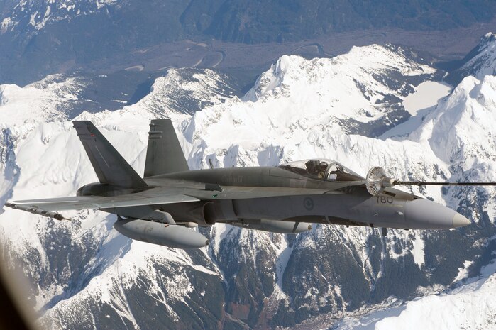 Seen from the window of a Canadian Forces CC-150 Polaris tanker, a CF-18 Hornet fighter jet refuels in the air over Vancouver during Operation PODIUM.

Operation PODIUM is the Canadian Forces (CF) contribution to the overall security of the Vancouver 2010 Olympic and Paralympic Winter Games in support of the Royal Canadian Mounted Police (RCMP)-led Integrated Security Unit. The Air Force’s contribution is two-fold: The Air Component Command of Joint Task Force Games, which provides airlift, medical evacuation and area surveillance for the RCMP; and NORAD, which will ensure airspace security. 

During the Vancouver 2010 Olympic and Paralympic Winter Games, from February 12 to March 21, 2010, security and public safety agencies from all levels of government are working together to provide a safe and secure environment while the world celebrates winter sporting excellence.

