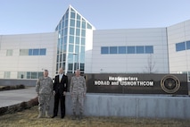 Mr. David Heyman (center), Assistant Secretary for Policy for the Department of Homeland Security, poses for a photo with Army Brig. Gen. Bob Felderman (left) and Air Force Maj. Gen. John Bordelon (right) in front of the North American Aerospace Defense Command and U.S. Northern Command Headquarters at Peterson Air Force Base, Colo., Apr. 13. Mr. Heyman visited the commands to become familiar with the missions and to specifically discuss air domain awareness and the Quadrennial Defense Review and Quadrennial Homeland Security Review. 

(Photo by Stacey Knott) 
