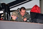 TYNDALL AIR FORCE BASE, Fla. - Capt. Michael “Slim” Palik, 43rd Fighter Squadron instructor pilot, points out the F-22’s cockpit technology to Jordan “Rocket” Shuman during his “Pilot for a Day” visit to Tyndall AFB, Fla., April 30. 

(Courtesy photo) 

