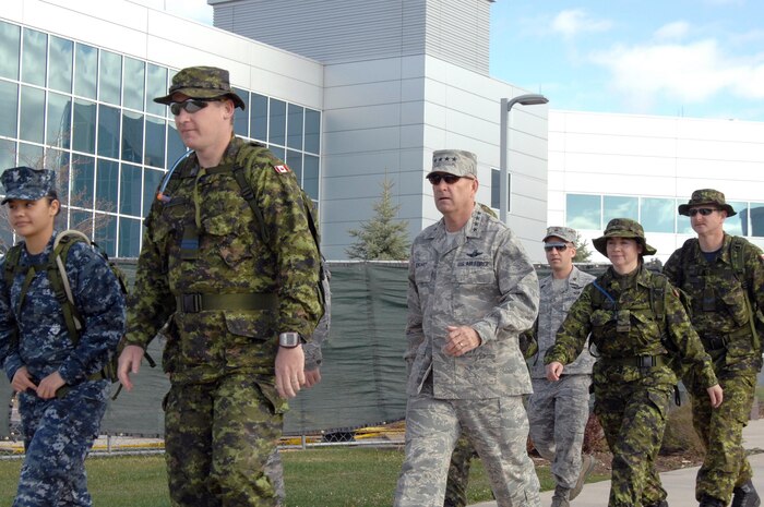 PETERSON AIR FORCE BASE, Colo. – Six members of the North American Aerospace Defense Command Nijmegen March team set out for a short training march with NORAD and U.S. Northern Command commander, Air Force Gen. Gene Renuart May 11. The NORAD team consists of 11 people, seven Canadians and four Americans, from the Alaskan NORAD Region, Continental U.S. NORAD Region, Colorado Springs, Colo., and Vandenberg AFB, Calif. The Nijmegen March is a four-day, 160 kilometer march (at 40 km per day) held annually that traces its roots to 1909. Held by the Dutch in an effort to keep their people fit in the age of “horseless carriages,” the march has only be cancelled twice, during the World Wars. This year, Canada is fielding 15 teams, one of which was allocated to NORAD. The march will be held July 20 – 23. 

(U.S. Air Force photo by Staff Sgt. Thomas J. Doscher) 

