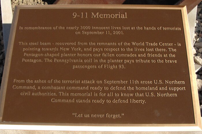 PETERSON AIR FORCE BASE, Colo. - The plaque of the new 9-11 memorial describes the design of the memorial and its three parts, the steel beam representing the World Trade Center, the five-sided planter representing the Pentagon, and Pennsylvania soil representing crash site of Flight 93. The memorial will be commemorated in a ceremony at 1 p.m. May 18. 

(U.S. Air Force photo by Staff Sgt. Thomas J. Doscher) 

