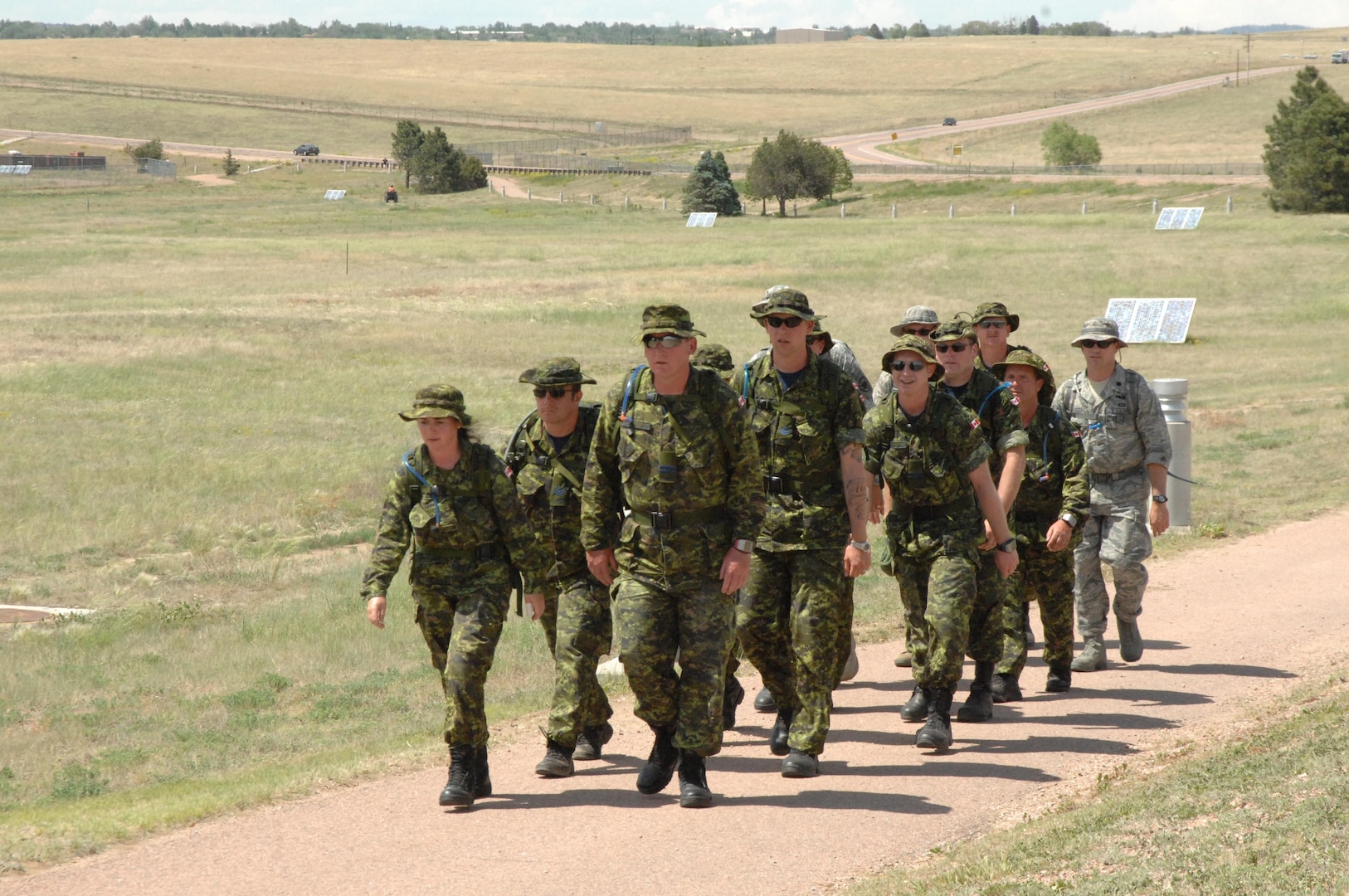 PETERSON AIR FORCE BASE, Colo. - The NORAD Nijmegen 2010 team marches on Peterson Air Force Base June 7 for their certification to participate in this year's Nijmegen March in The Netherlands in July. The NORAD team is comprised of 11 members, eight Canadian Forces and three U.S. forces, who will march in uniform with 22-pound rucksacks. The Nijmegen March begins July 20 in Nijmegen, The Netherlands. 

(U.S. Air Force photo by Staff Sgt. Thomas J. Doscher) 

