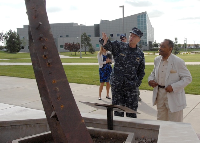 PETERSON AIR FORCE BASE, Colo. - Navy Adm. James Winnefeld, North American Aerospace Defense Command and U.S. Northern Command commander, shows Illinois Senator Roland Burris the commands’ Sept. 11 memorial during the Senator’s visit to the commands July 8. Burris, who sits on the Senate Armed Services Committee, made his first visit to the commands to familiarize himself with NORAD and USNORTHCOM’s operations and tour the headquarters and alternate command center at Cheyenne Mountain Air Force Station. 

(U.S. Air Force photo by Staff Sgt. Thomas J. Doscher) 

