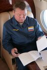 OVER THE PACIFIC OCEAN - Russian Air Force Col. Alexander Vasilyev reviews the exercise timeline on board Fencing 1220, the target of interest for Exercise VIGILANT EAGLE Aug. 8. VIGILANT EAGLE is a cooperative exercise involving the North American Aerospace Defense Command and the Russian Air Force. The exercise scenario creates a situation that requires both the Russian Air Force and NORAD to launch or divert fighter aircraft to investigate and follow a "hijacked" airliner. The exercise focuses on shadowing and the cooperative hand-off of the monitored aircraft between fighters of the participating nations. 

(U.S. Army photo by Maj. Mike Humphreys) 


