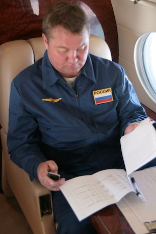 OVER THE PACIFIC OCEAN - Russian Air Force Col. Alexander Vasilyev reviews the exercise timeline on board Fencing 1220, the target of interest for Exercise VIGILANT EAGLE Aug. 8. VIGILANT EAGLE is a cooperative exercise involving the North American Aerospace Defense Command and the Russian Air Force. The exercise scenario creates a situation that requires both the Russian Air Force and NORAD to launch or divert fighter aircraft to investigate and follow a "hijacked" airliner. The exercise focuses on shadowing and the cooperative hand-off of the monitored aircraft between fighters of the participating nations. 

(U.S. Army photo by Maj. Mike Humphreys) 

