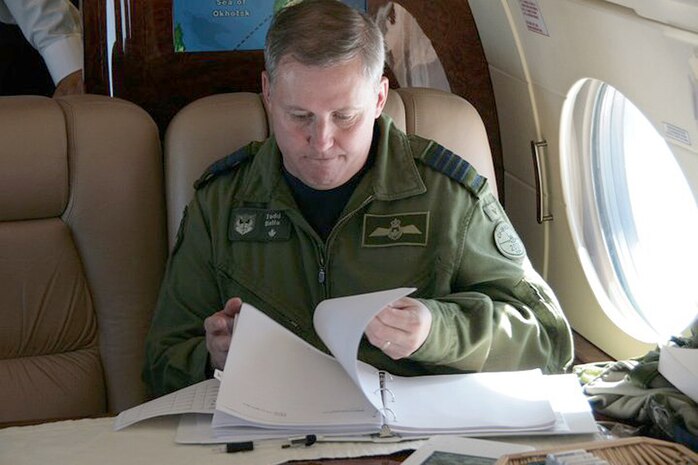 OVER THE PACIFIC OCEAN - Canadian Forces Col. Todd Balfe, deputy Commander Alaska NORAD Region, reviews the exercise timeline on board Fencing 1220, the target of interest for Exercise VIGILANT EAGLE Aug. 8. VIGILANT EAGLE is a cooperative exercise involving the North American Aerospace Defense Command and the Russian Air Force. The exercise scenario creates a situation that requires both the Russian Air Force and NORAD to launch or divert fighter aircraft to investigate and follow a "hijacked" airliner. The exercise focuses on shadowing and the cooperative hand-off of the monitored aircraft between fighters of the participating nations. 

(U.S. Army photo by Maj. Mike Humphreys) 

