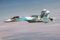OVER THE PACIFIC OCEAN - A Russian SU-27 fighter flies alongside Fencing 1220, the target of interest for Exercise VIGILANT EAGLE, Aug. 8. VIGILANT EAGLE is a cooperative exercise involving the North American Aerospace Defense Command and the Russian Air Force. The exercise scenario creates a situation that requires both the Russian Air Force and NORAD to launch or divert fighter aircraft to investigate and follow a "hijacked" airliner. The exercise focuses on shadowing and the cooperative hand-off of the monitored aircraft between fighters of the participating nations. 

(U.S. Army photo by Maj. Mike Humphreys) 

