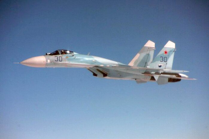 OVER THE PACIFIC OCEAN - A Russian SU-27 fighter flies alongside Fencing 1220, the target of interest for Exercise VIGILANT EAGLE, Aug. 8. VIGILANT EAGLE is a cooperative exercise involving the North American Aerospace Defense Command and the Russian Air Force. The exercise scenario creates a situation that requires both the Russian Air Force and NORAD to launch or divert fighter aircraft to investigate and follow a "hijacked" airliner. The exercise focuses on shadowing and the cooperative hand-off of the monitored aircraft between fighters of the participating nations. 

(U.S. Army photo by Maj. Mike Humphreys) 

