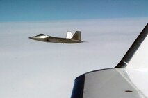 OVER THE PACIFIC OCEAN - An F-22 Raptor fighters takes position alongside Fencing 1220, the target of interest for Exercise VIGILANT EAGLE, shortly after take-off, Aug. 8. VIGILANT EAGLE is a cooperative exercise involving the North American Aerospace Defense Command and the Russian Air Force. The exercise scenario creates a situation that requires both the Russian Air Force and NORAD to launch or divert fighter aircraft to investigate and follow a "hijacked" airliner. The exercise focuses on shadowing and the cooperative hand-off of the monitored aircraft between fighters of the participating nations. 

(U.S. Army photo by Maj. Mike Humphreys) 

