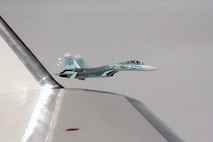 OVER THE KAMCHATKA PENINSULA - A Russian SU-27 fighter escorts Fencing 1220, a Gulfstream 4 simulating a hijacked airliner, over the Kamchatka Peninsula as part of Exercise VIGILANT EAGLE Aug. 8. VIGILANT EAGLE is a cooperative exercise involving the North American Aerospace Defense Command and the Russian Air Force. The exercise scenario creates a situation that requires both the Russian Air Force and NORAD to launch or divert fighter aircraft to investigate and follow a "hijacked" airliner. The exercise focuses on shadowing and the cooperative hand-off of the monitored aircraft between fighters of the participating nations. 

(U.S. Army photo by Maj. Mike Humphreys) 

