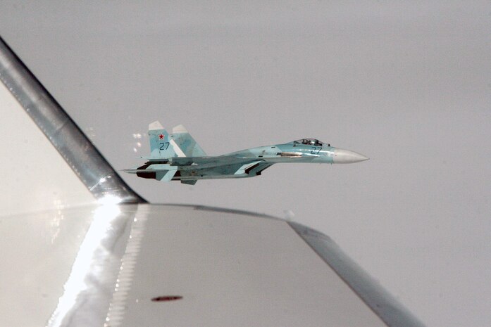 OVER THE KAMCHATKA PENINSULA - A Russian SU-27 fighter escorts Fencing 1220, a Gulfstream 4 simulating a hijacked airliner, over the Kamchatka Peninsula as part of Exercise VIGILANT EAGLE Aug. 8. VIGILANT EAGLE is a cooperative exercise involving the North American Aerospace Defense Command and the Russian Air Force. The exercise scenario creates a situation that requires both the Russian Air Force and NORAD to launch or divert fighter aircraft to investigate and follow a "hijacked" airliner. The exercise focuses on shadowing and the cooperative hand-off of the monitored aircraft between fighters of the participating nations. 

(U.S. Army photo by Maj. Mike Humphreys) 


