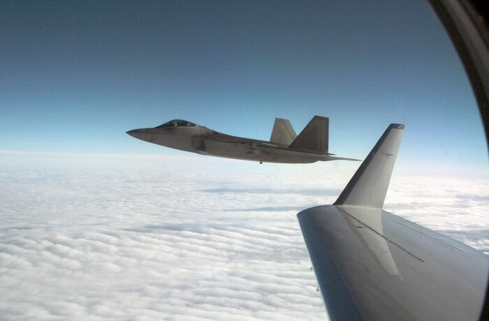 OVER ALASKA - An F-22 fighter escorts Fencing 1220, a Gulfstream 4 simulating a hijacked airliner, over Alaska as part of Exercise VIGILANT EAGLE Aug. 8. VIGILANT EAGLE is a cooperative exercise involving the North American Aerospace Defense Command and the Russian Air Force. The exercise scenario creates a situation that requires both the Russian Air Force and NORAD to launch or divert fighter aircraft to investigate and follow a "hijacked" airliner. The exercise focuses on shadowing and the cooperative hand-off of the monitored aircraft between fighters of the participating nations. 

(U.S. Army photo by Maj. Mike Humphreys)
