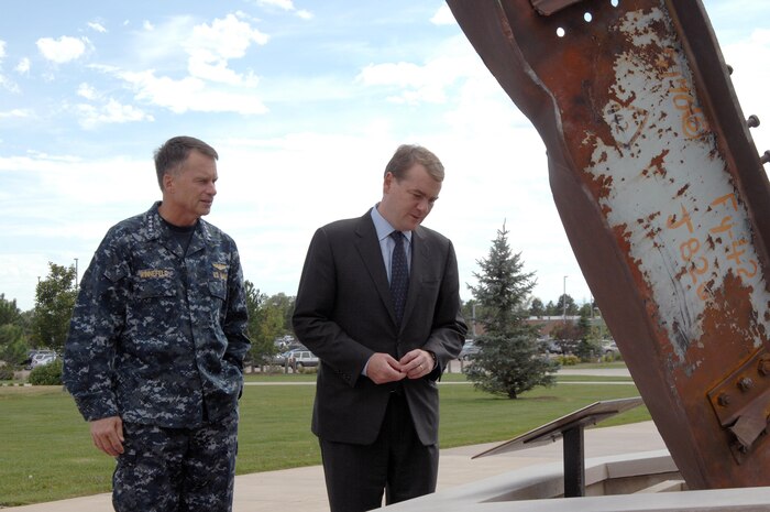 PETERSON AIR FORCE BASE, Colo. - Navy Adm. James Winnefeld, North American Aerospace Defense Command and U.S. Northern Command commander, shows Colorado Sen. Michael Bennet the NORAD and USNORTHCOM 9-11 Memorial outside the commands' headquarters Aug. 27. Bennet visited the commands to receive an orientation and tour the NORAD and USNORTHCOM command center. 

(U.S. Air Force photo by Staff Sgt. Thomas J. Doscher) 

