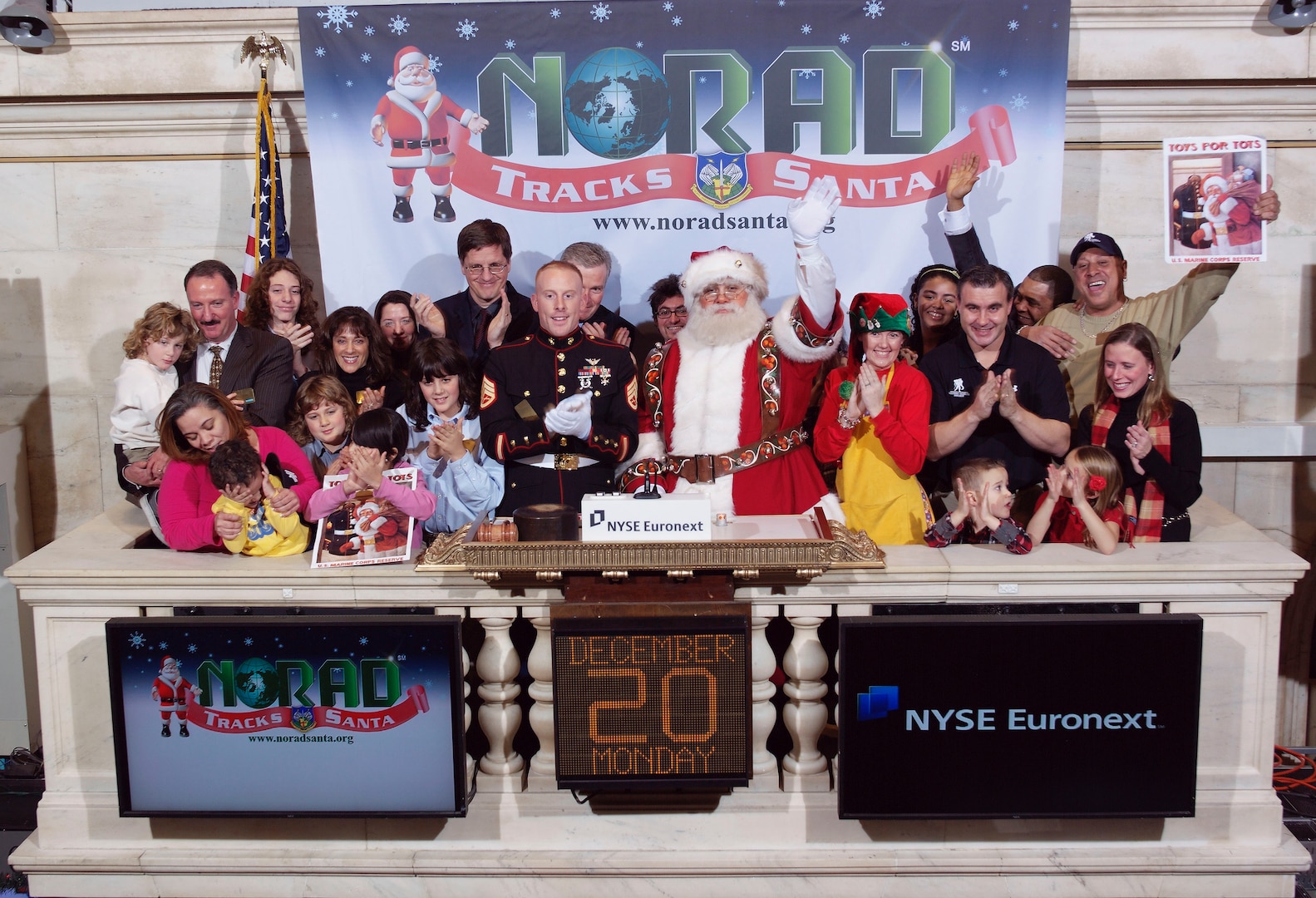 NEW YORK - NORAD Tracks Santa, Marine Toys for Tots and NTS corporate partners teamed up with Santa Claus to ring the closing bell at the New York Stock Exchange Dec. 20. Santa trackers will begin answering phones and replying to email at 2:00 a.m. MST (4:00 a.m. EST) on December 24 and will continue until 3:00 a.m. MST (5:00 a.m. EST) December 25. Children of all ages can then call the NTS toll-free number 1-877-Hi-NORAD (1-877-446-6723) or send an email to noradtrackssanta@gmail.com. 

(Photo courtesy of the New York Stock Exchange) 



