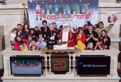 NEW YORK - NORAD Tracks Santa, Marine Toys for Tots and NTS corporate partners teamed up with Santa Claus to ring the closing bell at the New York Stock Exchange Dec. 20. Santa trackers will begin answering phones and replying to email at 2:00 a.m. MST (4:00 a.m. EST) on December 24 and will continue until 3:00 a.m. MST (5:00 a.m. EST) December 25. Children of all ages can then call the NTS toll-free number 1-877-Hi-NORAD (1-877-446-6723) or send an email to noradtrackssanta@gmail.com. 

(Photo courtesy of the New York Stock Exchange) 



