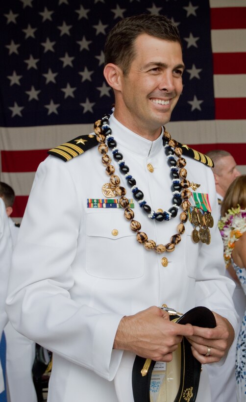 Cmdr. Daniel Nowicki, incoming commanding officer of Helicopter Anti-Submarine Squadron Light 37, smiles as guests offer congratulations after the change of command ceremony at Hangar 103, April 18, 2013. Nowicki took command from Cmdr. Gregory Thoroman, whose next assignment is the Office of the Assistant Secretary of the Navy in Washington, D.C. The squadron’s new executive officer is Cmdr. Brannon Bickel. (U.S. Marine Corps photo by Kristen Wong)