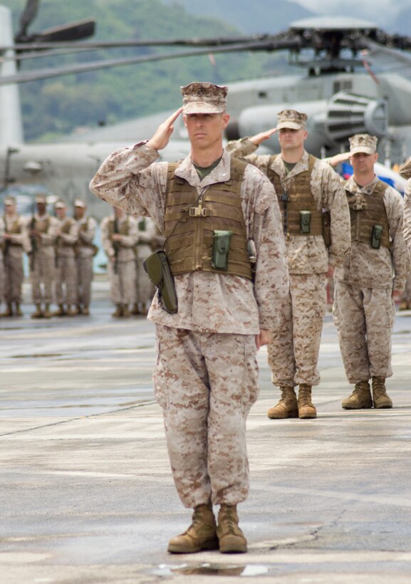 Lt. Col. Jeffrey Davis, outgoing commanding officer, Marine Heavy Helicopter Squadron 463, renders a salute during a change of command ceremony between Hangars 102 and 103, April 23, 2013. (U.S. Marine Corps photo by Kristen Wong)