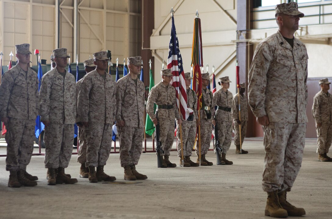 Marine Wing Support Detachment 24 is called to attention before being given the command to present arms for the playing of the "Marines’ Hymn," April 24, 2013. (U.S. Marine Corps photo by Lance Cpl. Matthew Bragg)