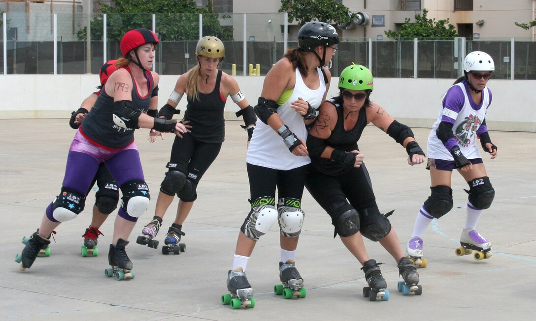 Skaters in Pacific Roller Derby practice in the G Street hockey rink at Marine Corps Base Hawaii. (U.S. Marine Corps photo by Carolyn Lee)