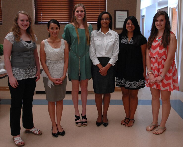 (Left to Right) Alyssa Presley, Joseline Roux, Kyersten Parks, Diamond Lawson, Alicia Dorado and Bethany Dempsey, The Dyess Spouses’ Club Scholarship Award winners, stand for a photograph at the Dyess Chapel April 21, 2013, during a presentation ceremony here. This year the Dyess Spouses’ Club awarded $16,000 to nine military dependents.