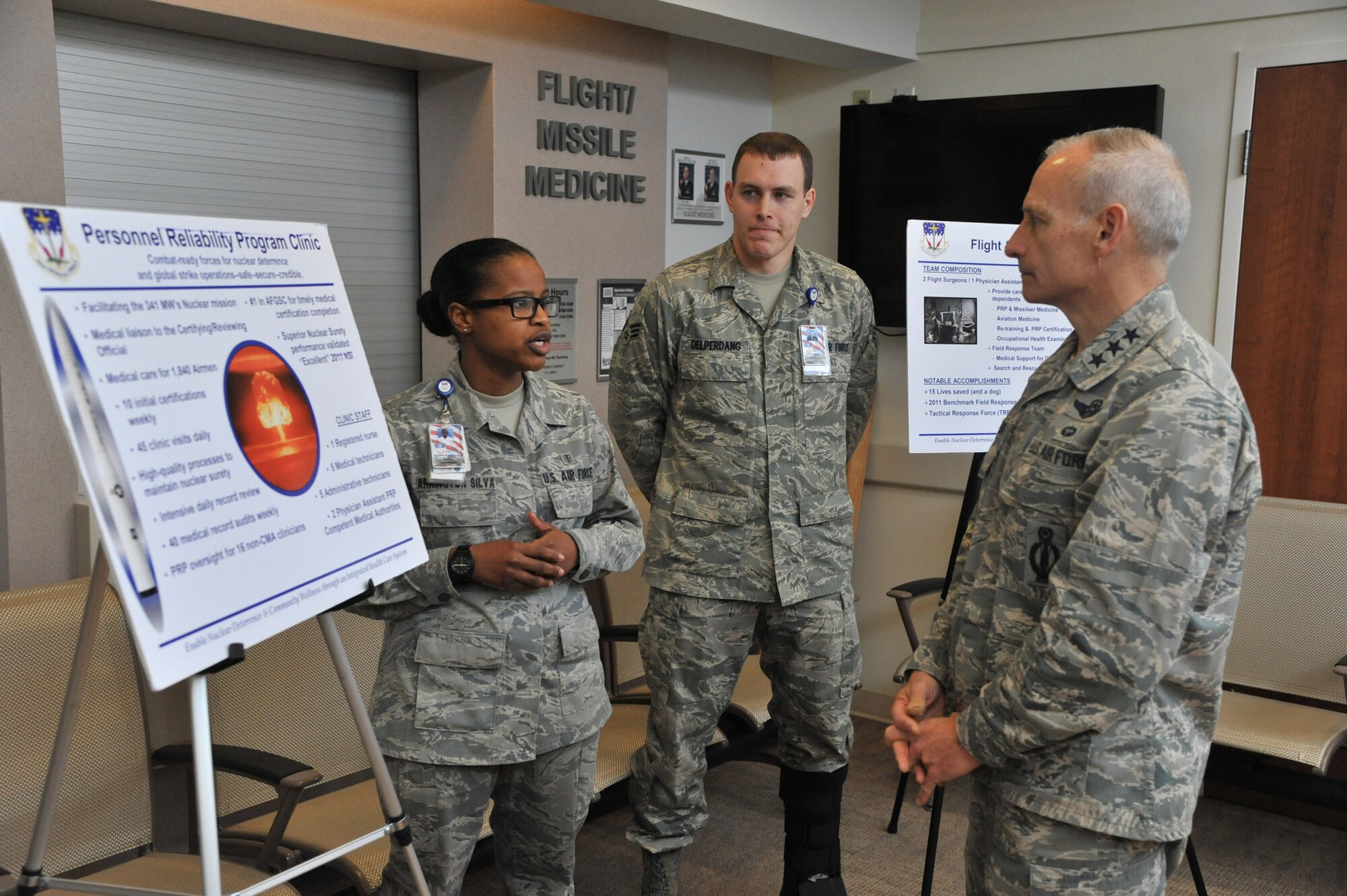 Lt. Gen. James Kowalski, commander of Air Force Global Strike Command, speaks with Airman 1st Class Christina Arrington Silva, and Senior Airman Aaron Delperdang, both 341st Medical Operations Squadron medical technicians, about the Personnel Reliability Program at Malmstrom Air Force Base.  Along with the base clinic, Kowalski had a chance to visit the Elkhorn Dining Facility, Explosive Ordnance Disposal team, 341st Civil Engineer Squadron Fire Trainer and other places on base.  (U.S. Air Force photo/John Turner)