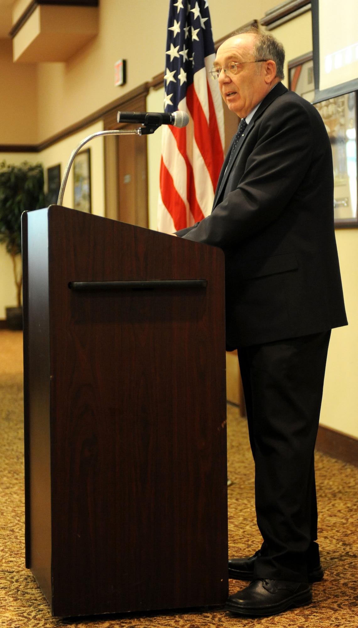Air Force Lt. Col. (Ret) Michael Prusak, serves as the guest speaker during Holocaust remembrance luncheon at the Recce Point Club on Beale Air Force Base Calif., April 25, 2013. Prusak was born in a displaced persons camp in Germany after his parents survived the Holocaust. (U.S. Air Force photo by Airman 1st Class Bobby Cummings/Released)