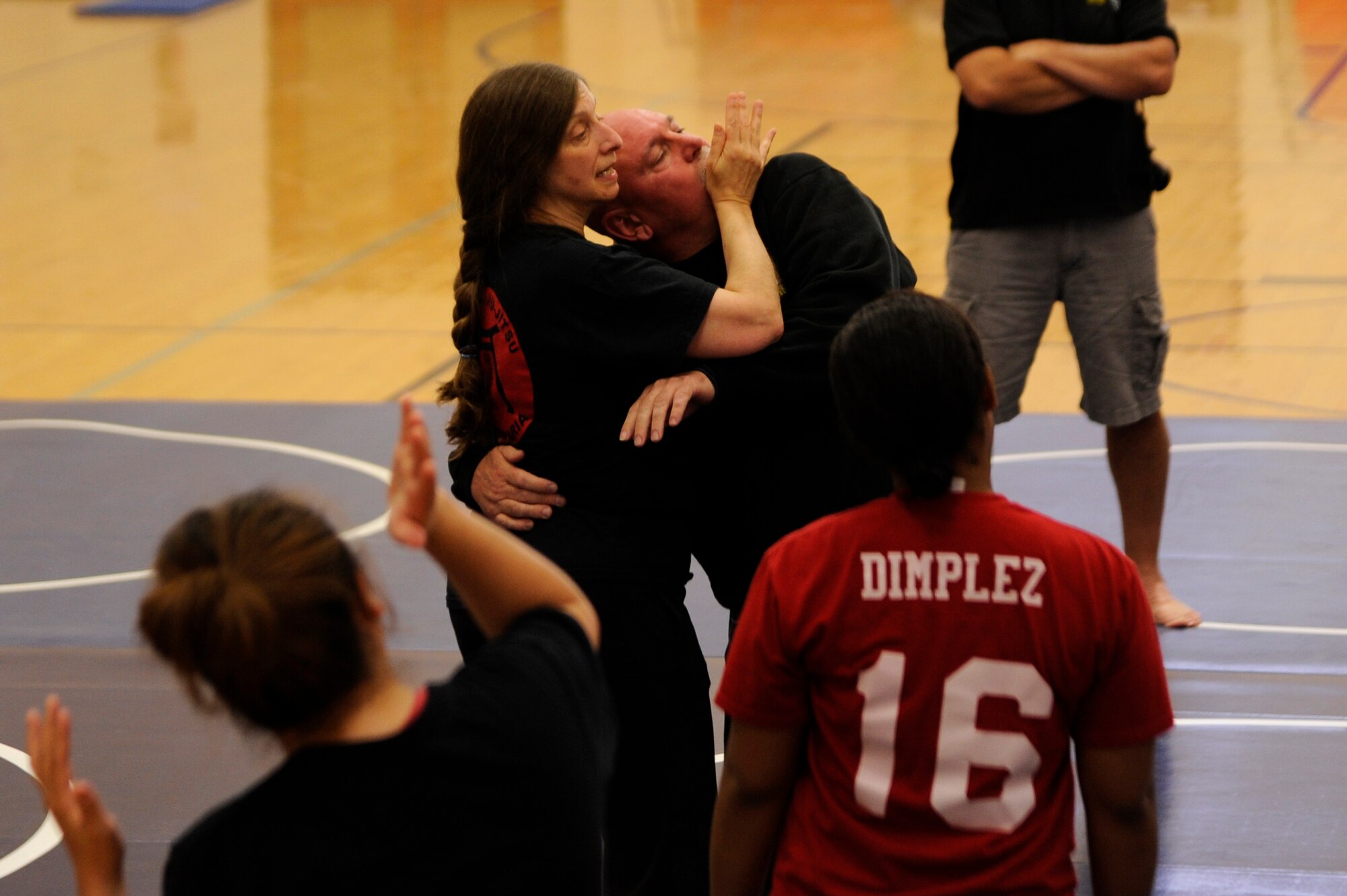 VANDENBERG AIR FORCE BASE, Calif. – Valerie Anne Pellar, a Seki-Ryu Jiu-Jitsu 2nd degree black belt, teaches a neck twist maneuver to Team V members during an annual self-defense course at the base gym here Thursday, April 25, 2013.Seki-Ryu Jiu-Jitsu is a real world self-defense training that includes escapes, joint locks, blocks, throws, strikes, kicks, submissions, and weapon defense techniques. (U.S. Air Force photo/Senior Airman Lael Huss)
