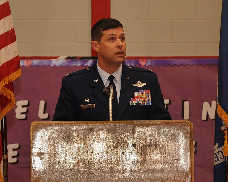 Col. Andrew Gebara, 2nd Bomb Wing commander, gives remarks during the Purple Up Day Mayoral Proclamation event at Elm Grove Middle School, Bossier City, La., April 26, 2013. The event included a poem from a military child, a flag folding ceremony by the Parkway Air Force Junior Reserve Officer Training Corps and a proclamation signing. The proclamation proclaimed April 26 as National Purple Up Day.  Purple Up Day was held to show support for military students and families. (U.S. Air Force photo/Senior Airman Sean Martin)
