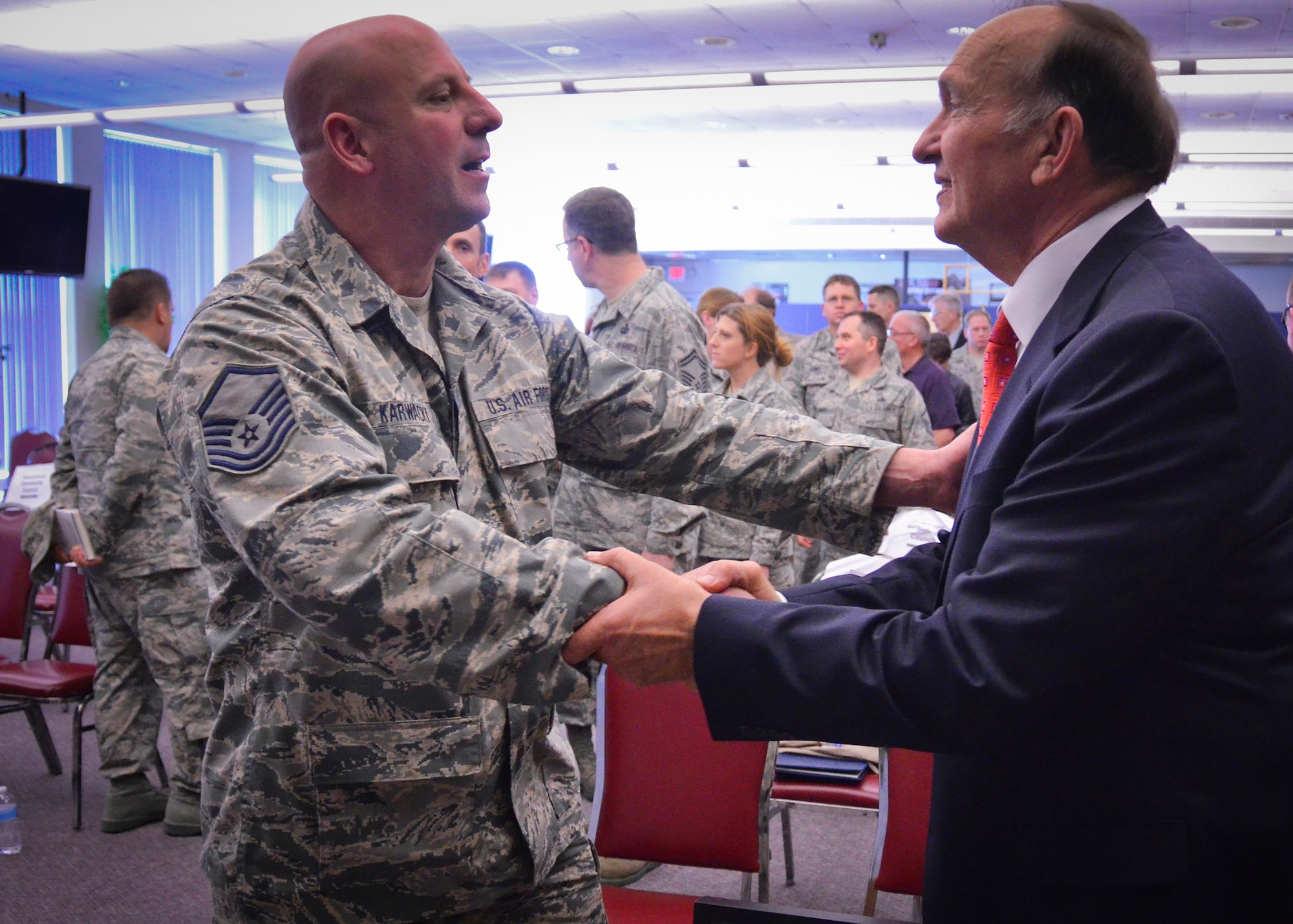 Wisconsin Air National Guardsman, Master Sgt. Tony Karwacki, shares a few words of respect and appreciation with retired Air Force Captain Guy Gruters following Gruters’ presentation at Milwaukee’s 128th Air Refueling Wing Thurs., April 25 2013.
Gruters, a Vietnam War prisoner of war who spent more than five years in an enemy prison camp, shared with the Airmen his story of courage and endurance in an enemy prison camp.
(U.S. Air National Guard photo by 1st Lt. Nathan Wallin/Released)