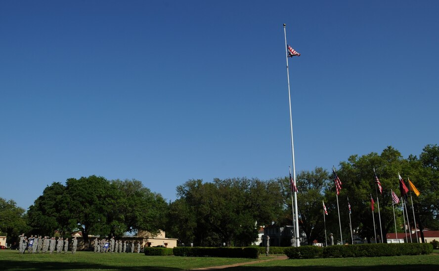 Students from Airman Leadership School class 13-4 students participate in a retreat ceremony on Barksdale Air Force Base, La., April 25, 2013. During the ceremony, flag detail is responsible for lowering, saluting and folding the flag. (U.S. Air Force photo/Airman 1st Class Benjamin Gonsier)