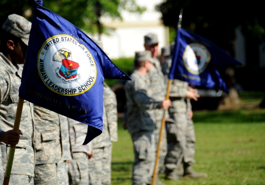 Airman Leadership School guidons wave in the air before a retreat ceremony on Barksdale Air Force Base, La., April 25, 2013. The retreat ceremony serves a two-fold purpose- it signals the end of the official duty day and pays respect to the flag. (U.S. Air Force photo/Airman 1st Class Benjamin Gonsier)