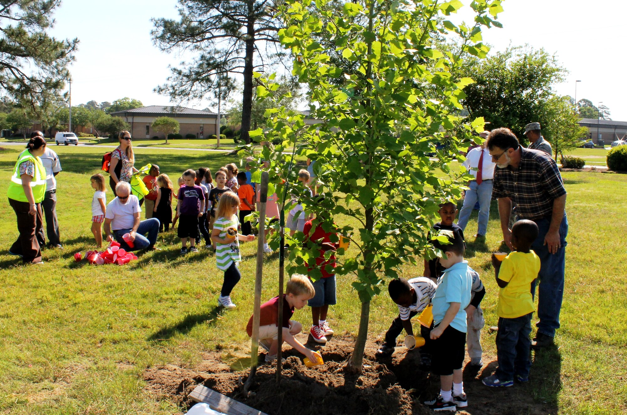 Children from the Georgia Pre-K Program at the child development center on base helped John Crain, 23d Civil Engineer Squadron base forester, plant a sycamore tree at Tree City during the 15th consecutive Arbor Day ceremony April 26, 2013 at Moody Air Force Base, Ga. The first Arbor Day was celebrated in 1872 in Nebraska where an estimated 1 million trees were planted. (Contributed photo/Released)