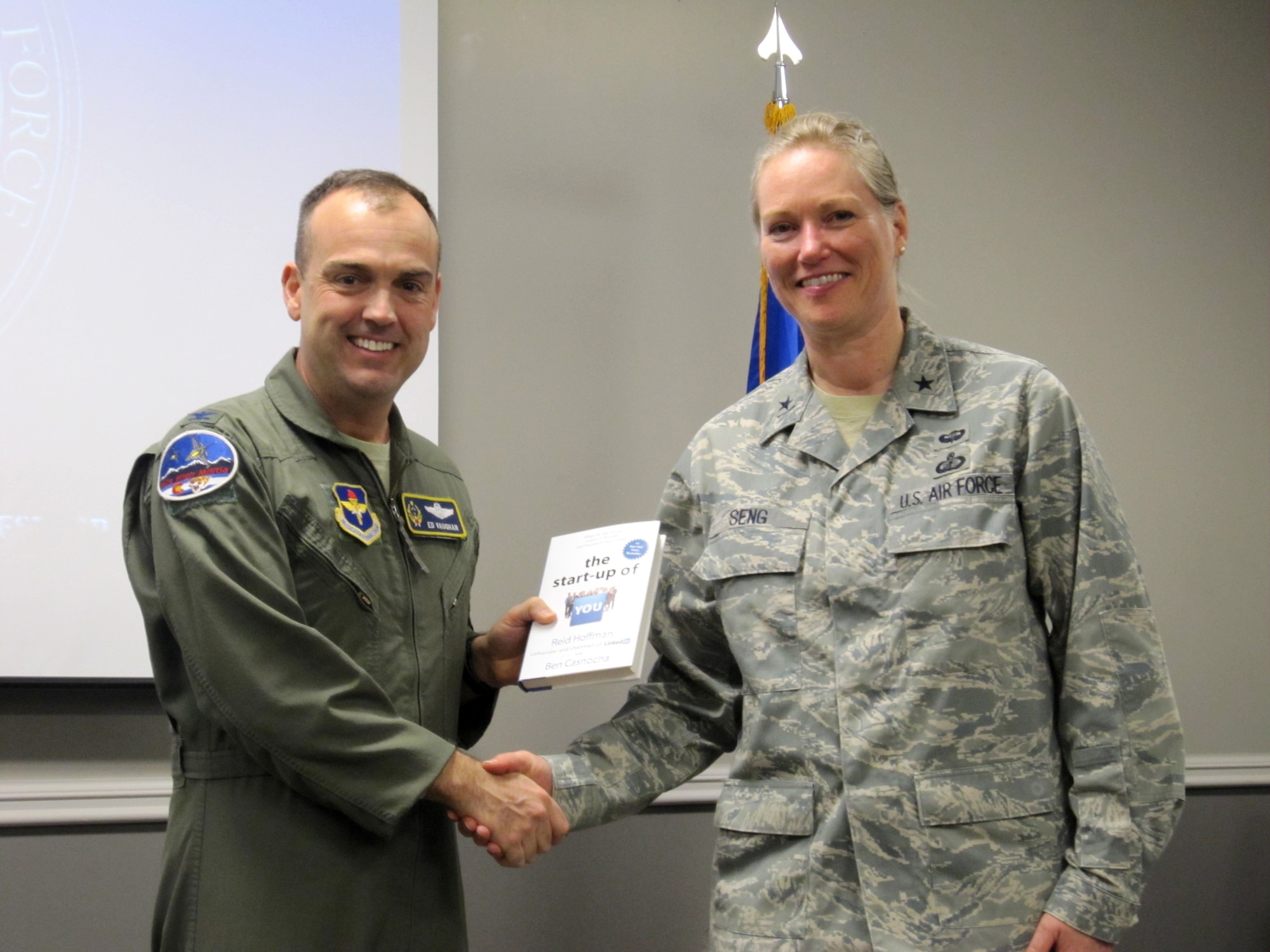 Colonel Edward Vaughan, Air National Guard adviser to the commander and president of the Air University and co-founder of GARNET, presents “The Startup of You,” a professional networking book, to Brig. Gen. Jocelyn Seng, mobilization assistant to the commander and president of the Air University, following her GARNET talk at Air War College in April at Maxwell Air Force Base, Ala. (U.S. Air Force photo by Lt. Col. Patricia York)
