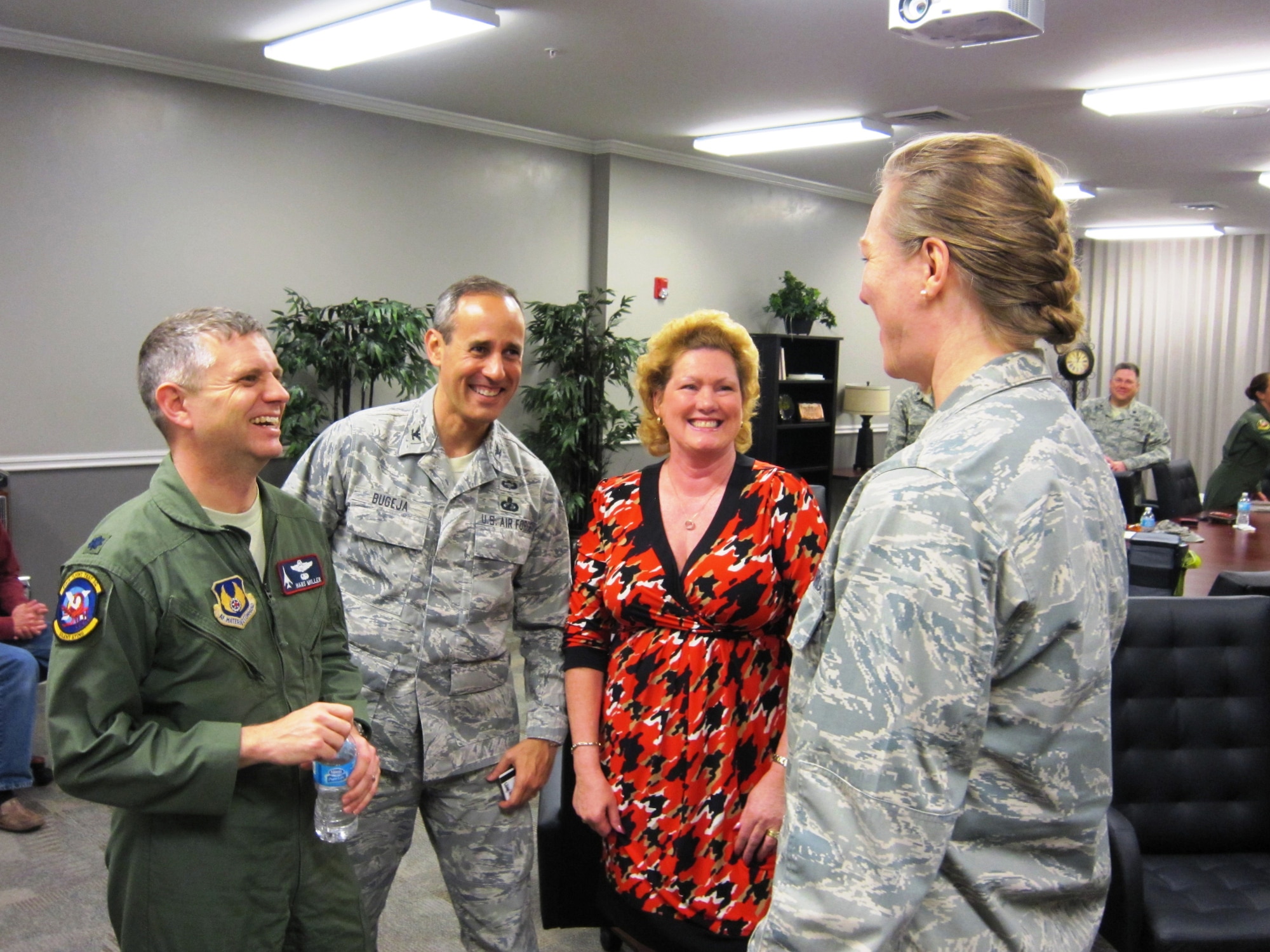 Lt. Col. Hans Miller, Air War College student; Col. Vince Bugeja, Reserve adviser to the commander of the Carl A. Spaatz Center for Officer Education; and Lt. Col. Joyce Guthrie, Public Affairs Center of Excellence, share a laugh with Brig. Gen. Jocelyn Seng, mobilization assistant to the commander and president of the Air University, following the general’s GARNET talk at the Air War College in April at Maxwell Air Force Base, Ala. (U.S. Air Force photo by Lt. Col. Patricia York)