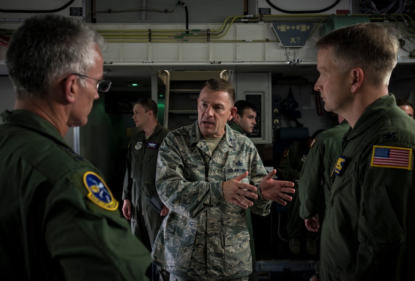 Col. Richard McComb, Joint Base Charleston commander (center), speaks with Gen. Paul Selva, Air Mobility Command commander (left), after a new C-17 Globemaster III was delivered April 25, 2013, at Joint Base Charleston – Air Base, S.C. Joint Base Charleston is scheduled to receive two additional C-17s this year, as Boeing completes work on the Air Force’s final Globemasters. The first C-17 to enter the Air Force’s inventory arrived at Charleston Air Force Base in June 1993. The C-17 is capable of rapid strategic delivery of troops and all types of cargo to main operating bases or directly to forward bases in the deployment area. (U.S. Air Force photo/ Senior Airman Dennis Sloan)