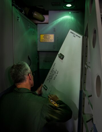 Gen. Paul Selva, Air Mobility Command commander, signs his name on the battery door after delivering a new C-17 Globemaster III April 25, 2013, at Joint Base Charleston – Air Base, S.C. Joint Base Charleston is scheduled to receive two additional C-17s this year, as Boeing completes work on the Air Force’s final Globemasters. The first C-17 to enter the Air Force’s inventory arrived at Charleston Air Force Base in June 1993. The C-17 is capable of rapid strategic delivery of troops and all types of cargo to main operating bases or directly to forward bases in the deployment area. (U.S. Air Force photo/ Senior Airman Dennis Sloan)