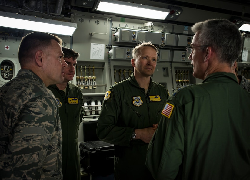 Gen. Paul Selva, Air Mobility Command commander (right), speaks with Col. Richard McComb, Joint Base Charleston commander (left), Col. Al Miller, 437th Airlift Wing vice commander, and Col. Darren Hartford, 437th AW commander, after delivering a new C-17 Globemaster III April 25, 2013, at Joint Base Charleston – Air Base, S.C. Joint Base Charleston is scheduled to receive two additional C-17s this year, as Boeing completes work on the Air Force’s final Globemasters. The first C-17 to enter the Air Force’s inventory arrived at Charleston Air Force Base in June 1993. The C-17 is capable of rapid strategic delivery of troops and all types of cargo to main operating bases or directly to forward bases in the deployment area. (U.S. Air Force photo/ Senior Airman Dennis Sloan)