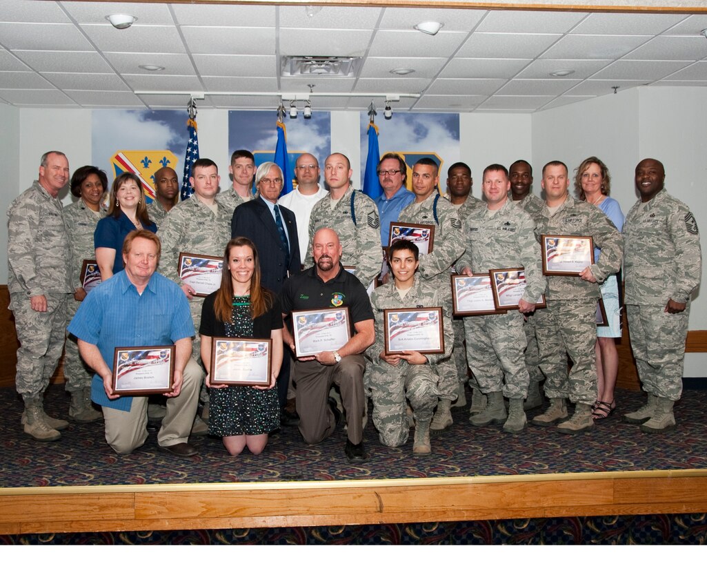 Brig. Gen. Michael Fantini (back left), 82nd Training Wing commander, and Chief Master Sgt. Eric Johnson (back right), 82nd TRW command chief, stand with the wing's FY13 2nd quarter award winners at the Sheppard Club April 26, 2013.  (U.S. Air Force photo/Joshua Felton)