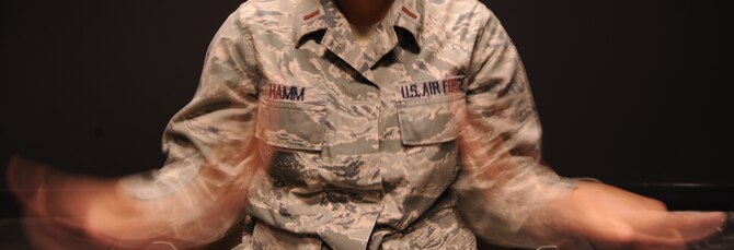 U.S. Air Force 2nd Lt. Mika Hamm, 23d Force Support Squadron readiness officer, enjoys American Sign Language because it gives her a way to communicate through facial expressions, gestures and body language.  While attending training at Tyndall Air Force Base, Fla., Hamm was able to interpret during a ceremony honoring a deaf civilian employee who had worked for the Air Force for 30 years. (U.S. Air Force photo by Master Sgt. Sonny Cohrs/Released)