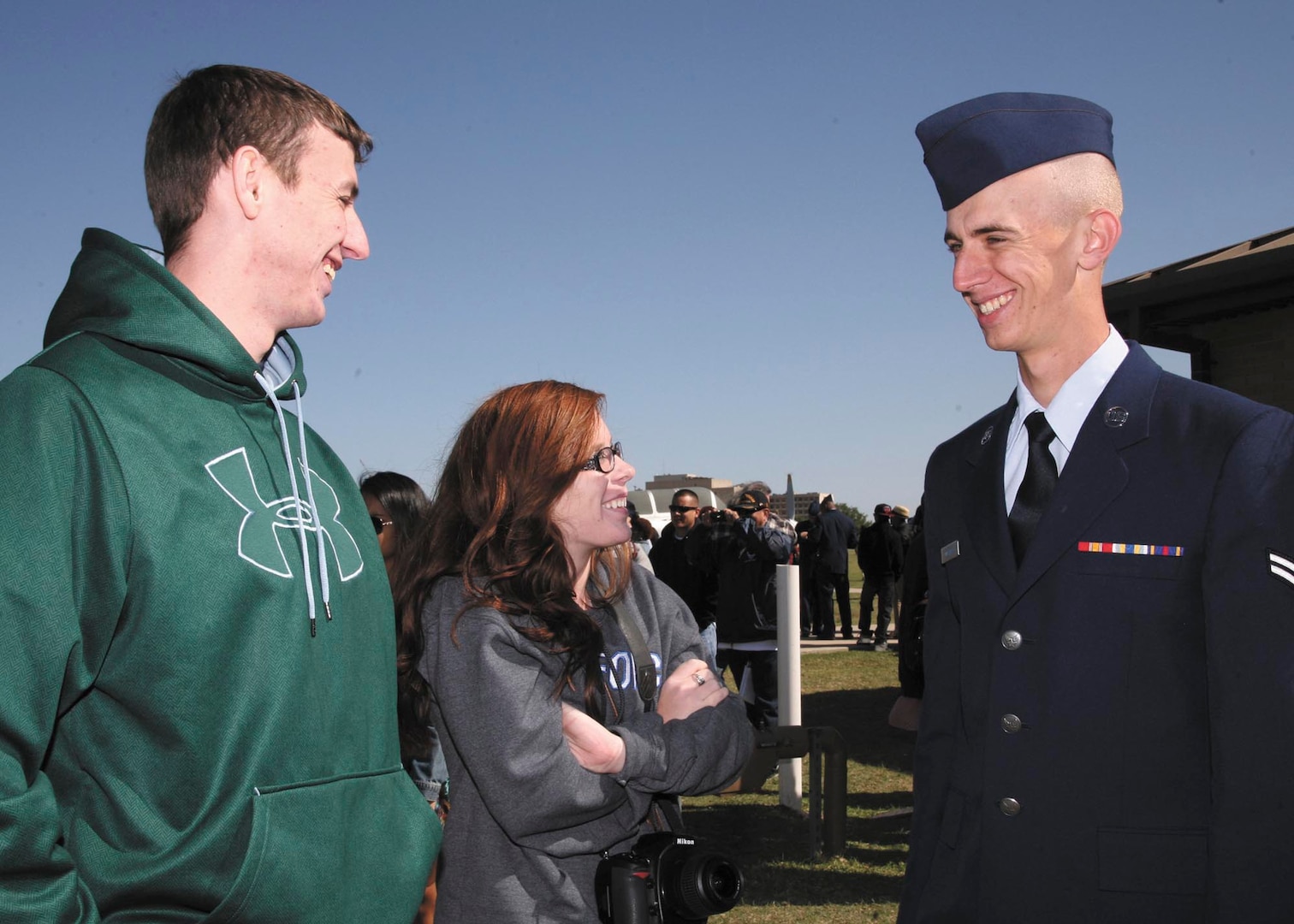 Airman First Class Devin Tillman (right) receives congratulations from his brother, William Tillman, and his girlfriend, Aubree Larson, after Air Force Basic Military Training graduation April 19 at Joint Base San Antonio-Lackland. Tillman’s family and friends traveled from Georgia to attend BMT graduation ceremonies.